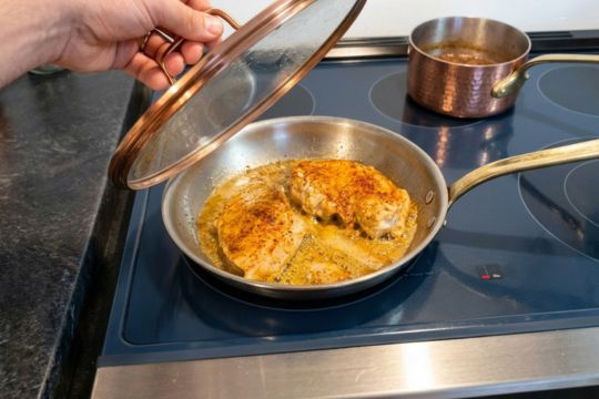 Chicken breast fried in a pan